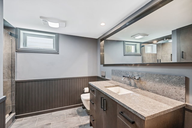 bathroom with vanity, toilet, and tile floors