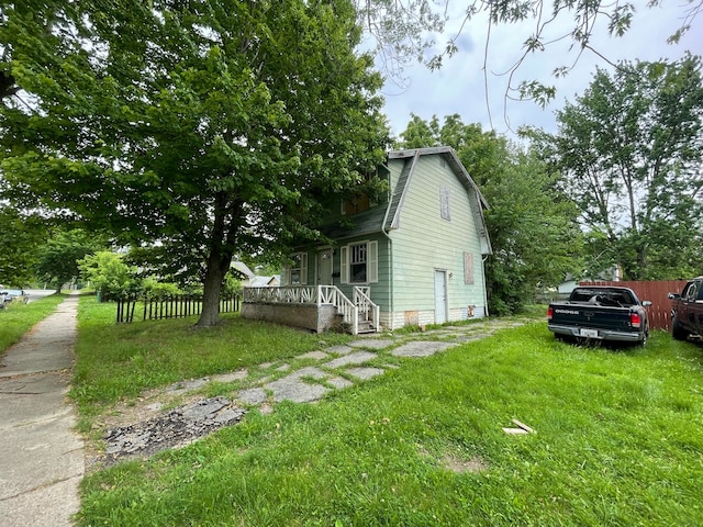 view of home's exterior with a lawn