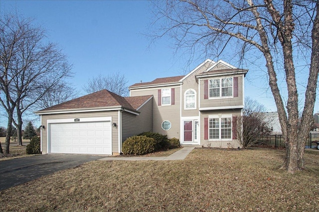 front of property with a front yard and a garage