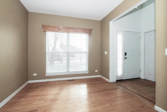 entrance foyer with light wood-type flooring