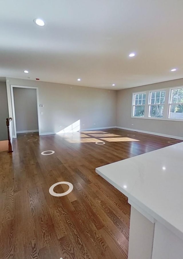 unfurnished room featuring dark wood-type flooring