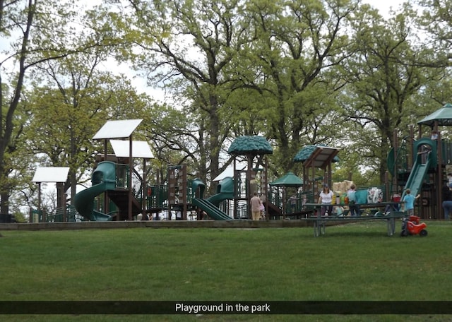 view of playground with a lawn