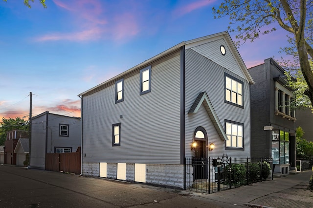 view of property exterior at dusk