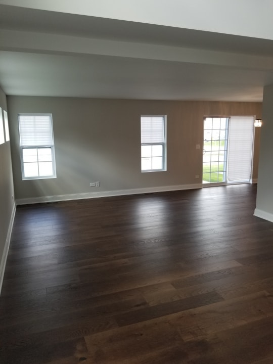 empty room featuring dark hardwood / wood-style flooring