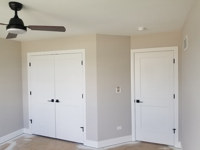 unfurnished bedroom with a closet, ceiling fan, and concrete floors