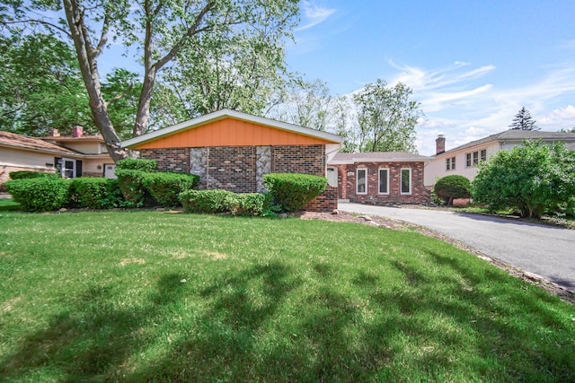 ranch-style home with a front yard