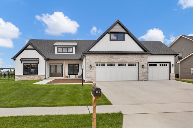 view of front facade with a garage and a front lawn