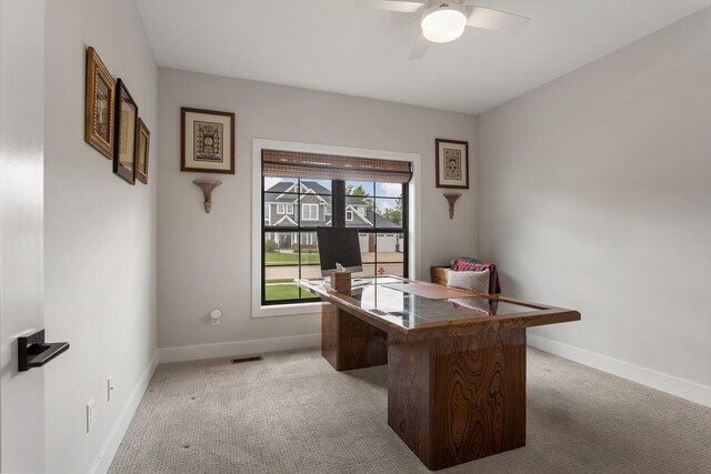 office with ceiling fan and carpet floors