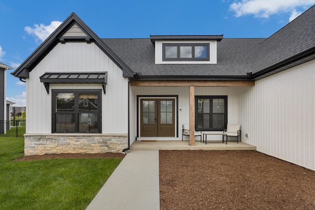 doorway to property featuring a yard