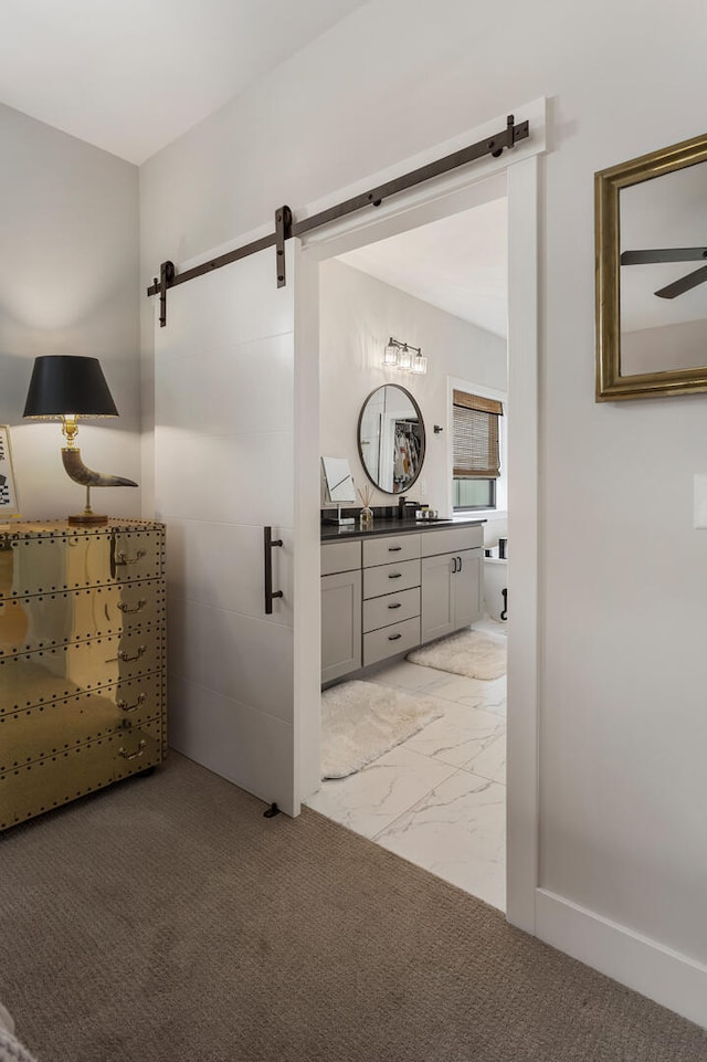 interior space featuring ceiling fan and vanity