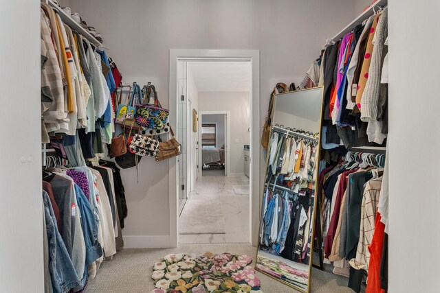 spacious closet featuring tile flooring