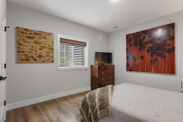 bedroom featuring hardwood / wood-style floors