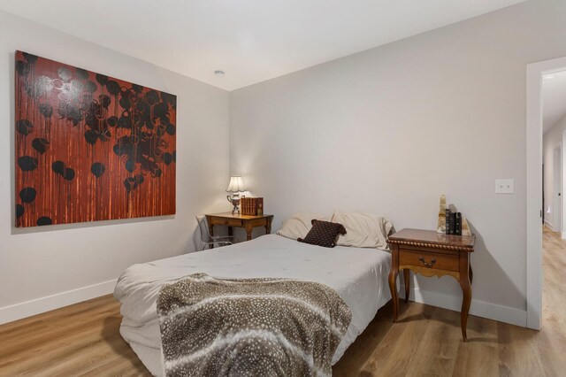 bedroom featuring light wood-type flooring