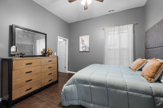 bedroom featuring ceiling fan and dark hardwood / wood-style flooring