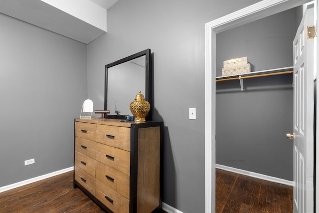 bedroom featuring dark hardwood / wood-style flooring