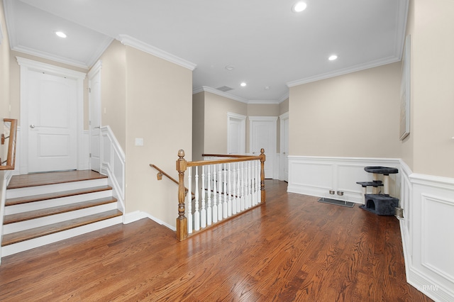 hall with crown molding and hardwood / wood-style floors