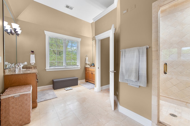 bathroom featuring a shower with shower door, vanity, and tile floors