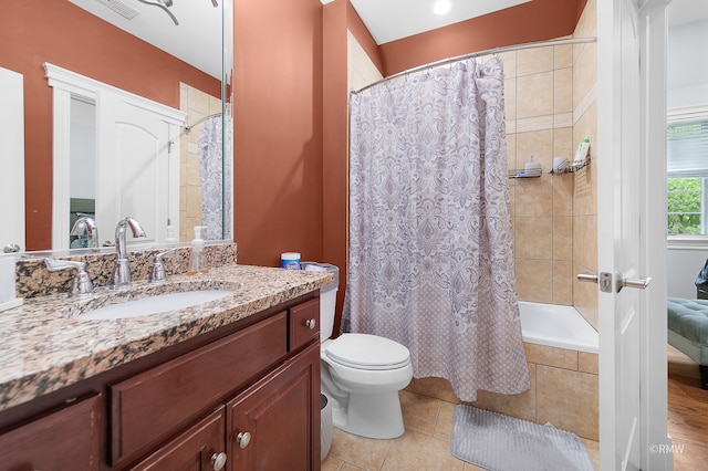 bathroom with vanity, toilet, and tile floors