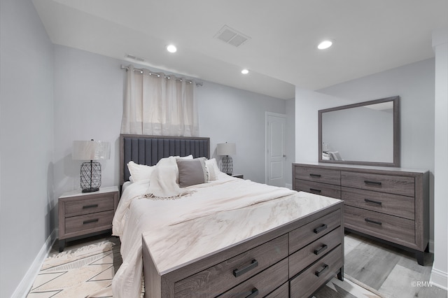 bedroom featuring light hardwood / wood-style floors