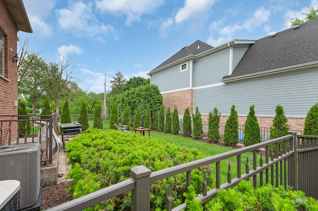 view of yard with central AC