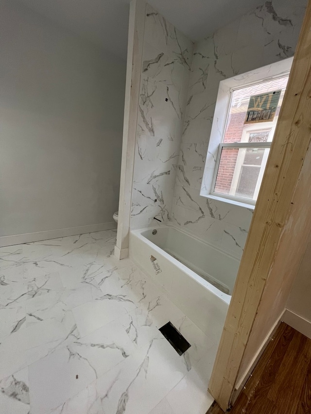 bathroom with tile floors and toilet