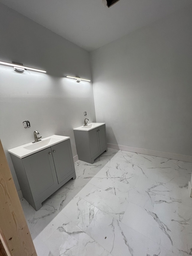 bathroom with dual vanity and tile floors