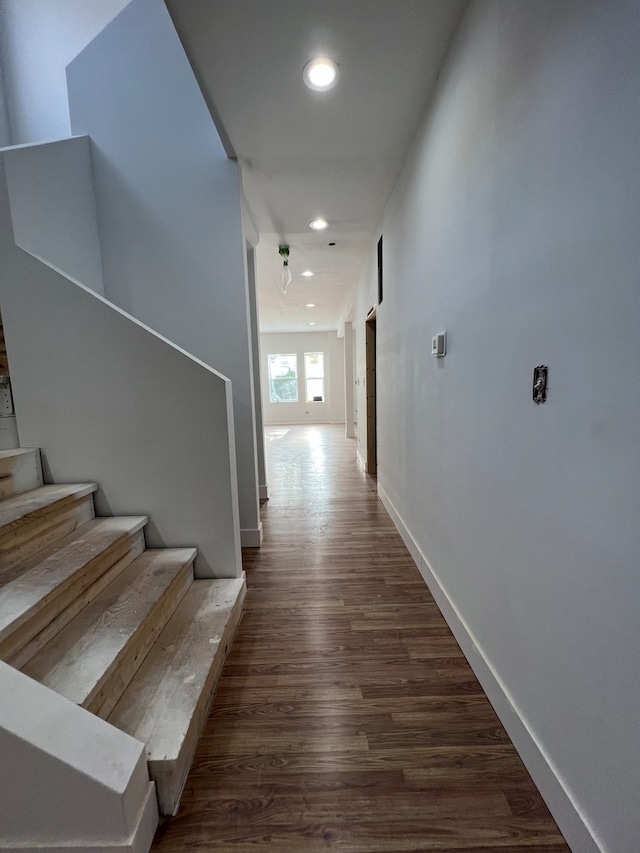 hall with dark hardwood / wood-style floors