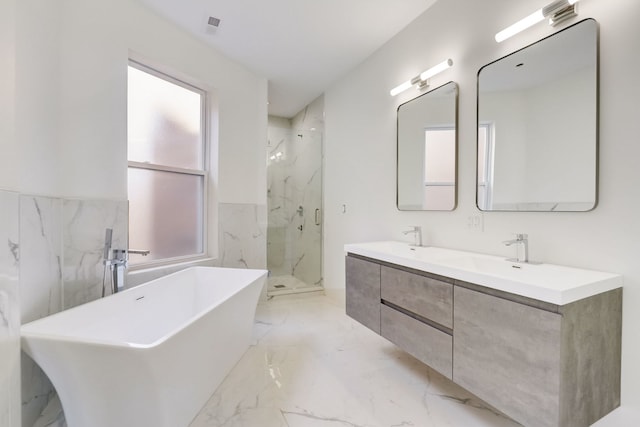 bathroom featuring tile flooring, large vanity, independent shower and bath, and double sink