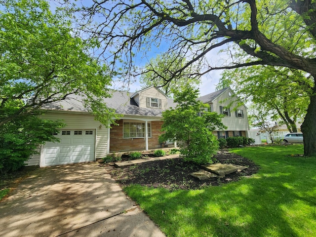 view of front of house with a garage and a front yard