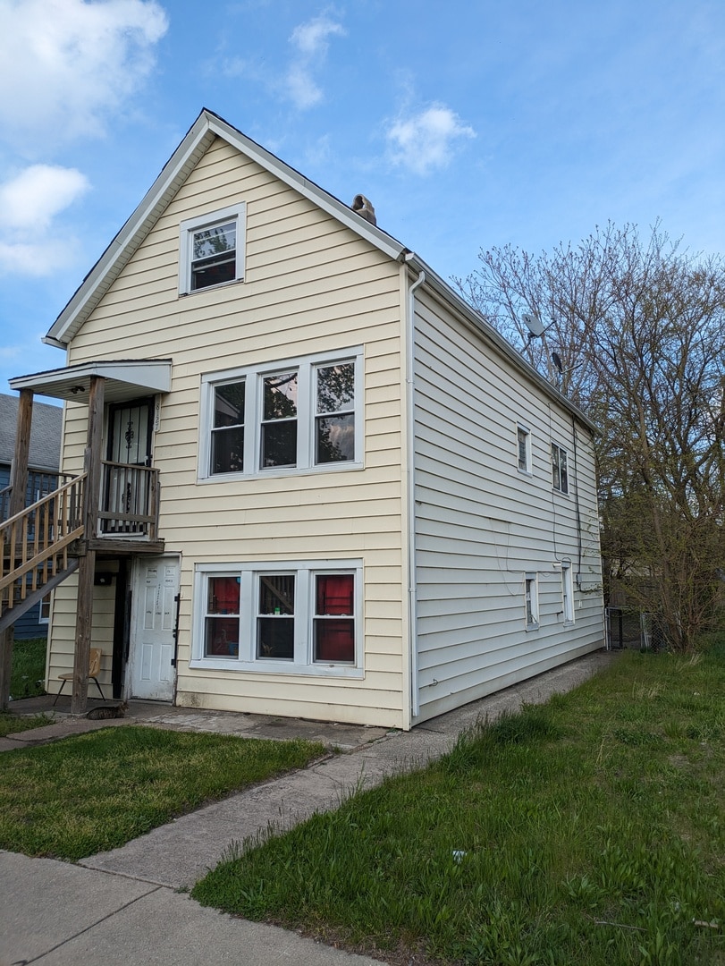 exterior space with a front lawn