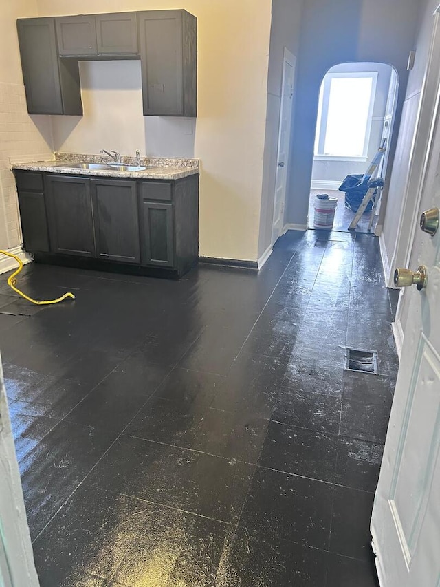 8127 S Coles Ave, Chicago, IL 60617 - kitchen with arched walkways and light countertops