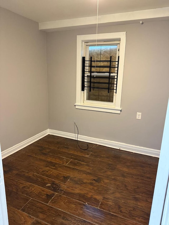 8127 S Coles Ave, Chicago, IL 60617 - spare room with dark wood-style flooring and baseboards