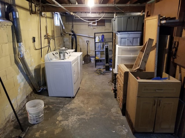 basement with washing machine and clothes dryer