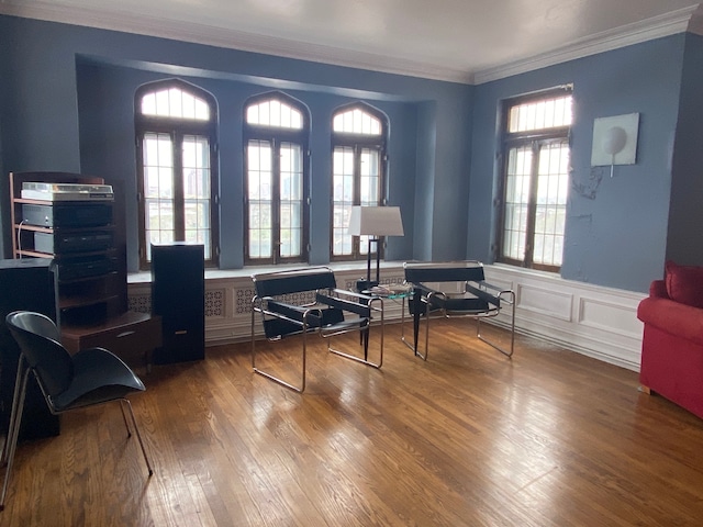 home office featuring crown molding and wood-type flooring