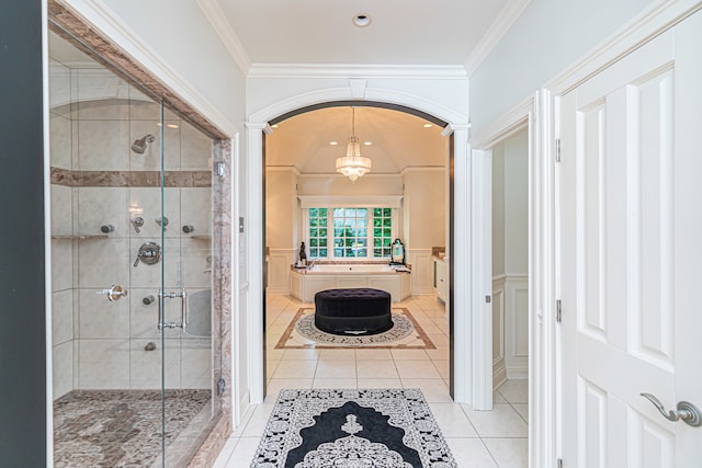 bathroom featuring tile floors, a shower with door, and ornamental molding