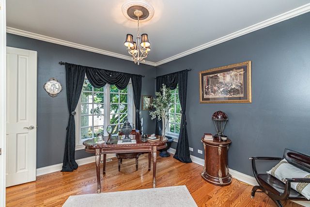 office with light hardwood / wood-style floors, ornamental molding, and a notable chandelier