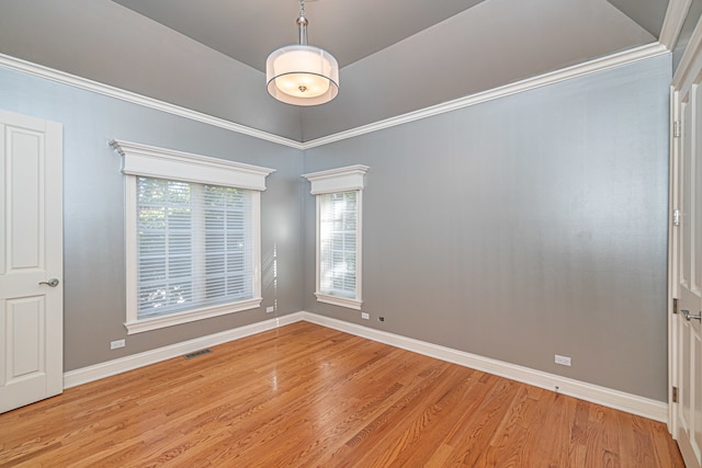 unfurnished room featuring a healthy amount of sunlight and light hardwood / wood-style floors