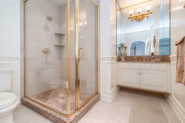 bathroom featuring tile flooring, walk in shower, vanity, and toilet