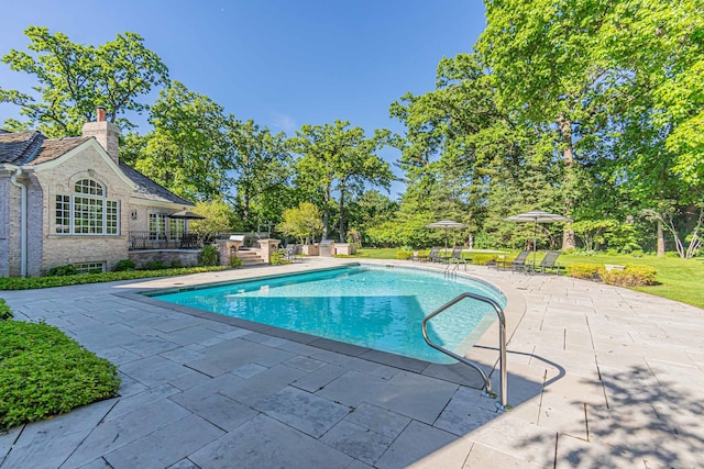 view of swimming pool with a patio area and a gazebo