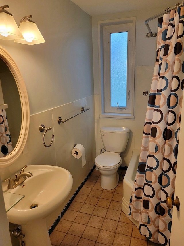 bathroom with sink, tile flooring, and toilet