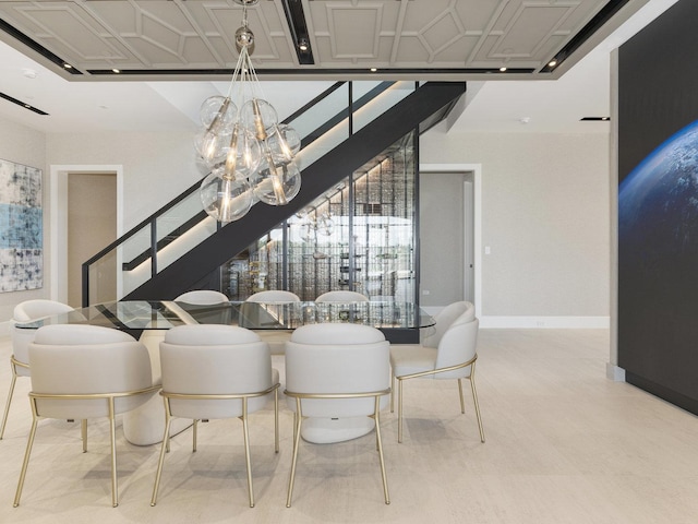 dining area featuring an inviting chandelier, baseboards, a healthy amount of sunlight, and stairway