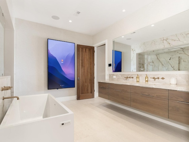 full bathroom featuring double vanity, visible vents, a sink, a marble finish shower, and a soaking tub