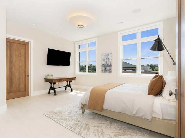bedroom featuring baseboards