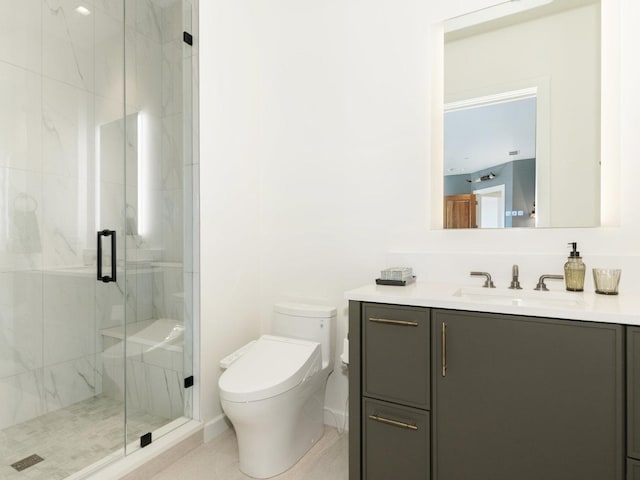 bathroom with vanity, a marble finish shower, and toilet