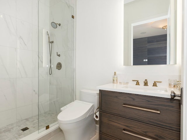 bathroom featuring a shower with shower door, vanity, and toilet