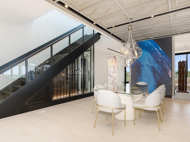 dining area with a notable chandelier and stairway
