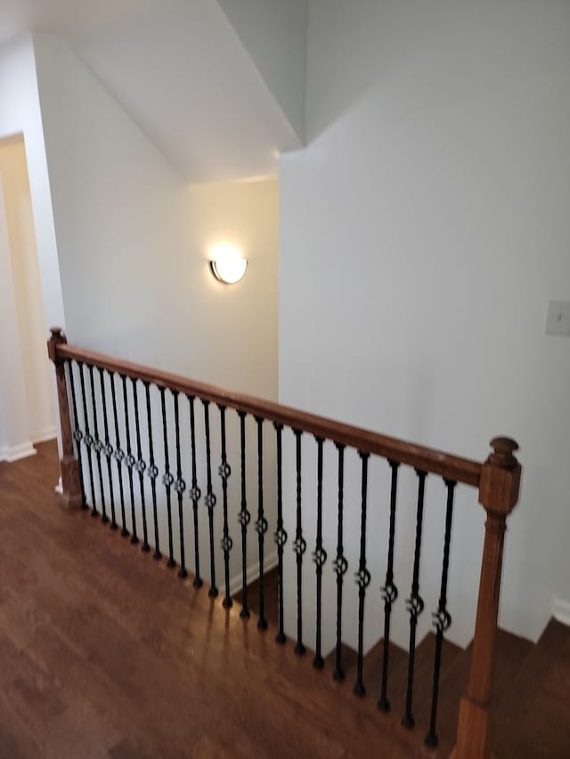 stairs featuring lofted ceiling and carpet flooring