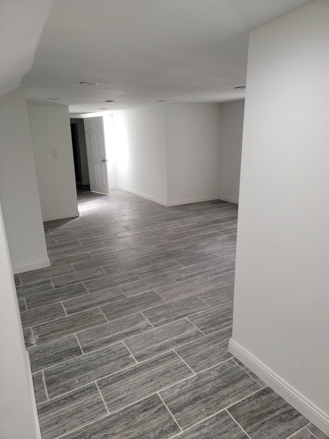 spare room featuring dark wood-type flooring