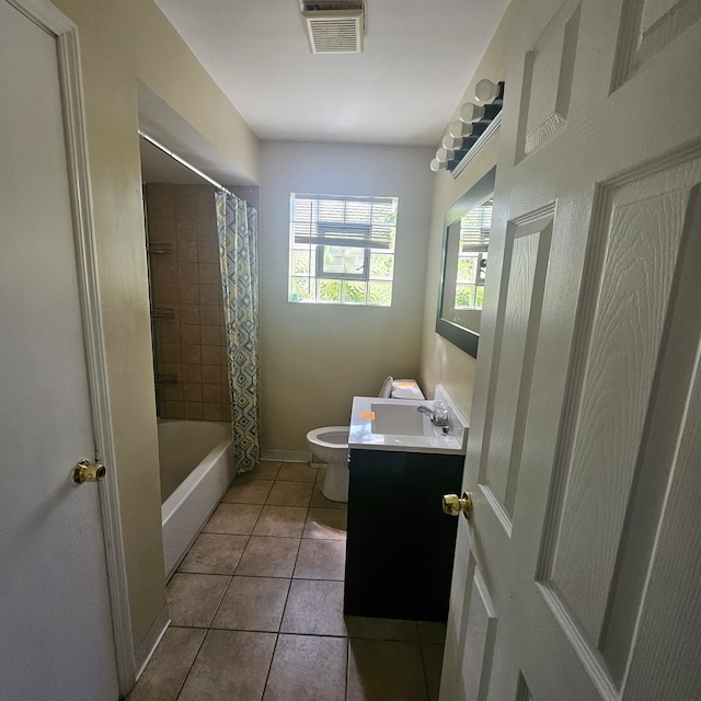 full bathroom featuring tile flooring, shower / bath combination with curtain, vanity, and toilet