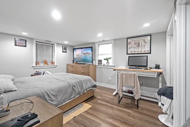 bedroom with hardwood / wood-style flooring